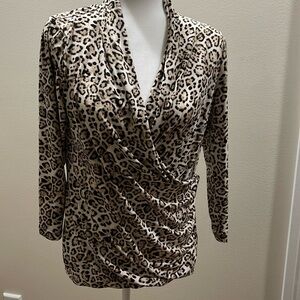 Leopard print top with draped neckline. Knit fabric with some stretch.